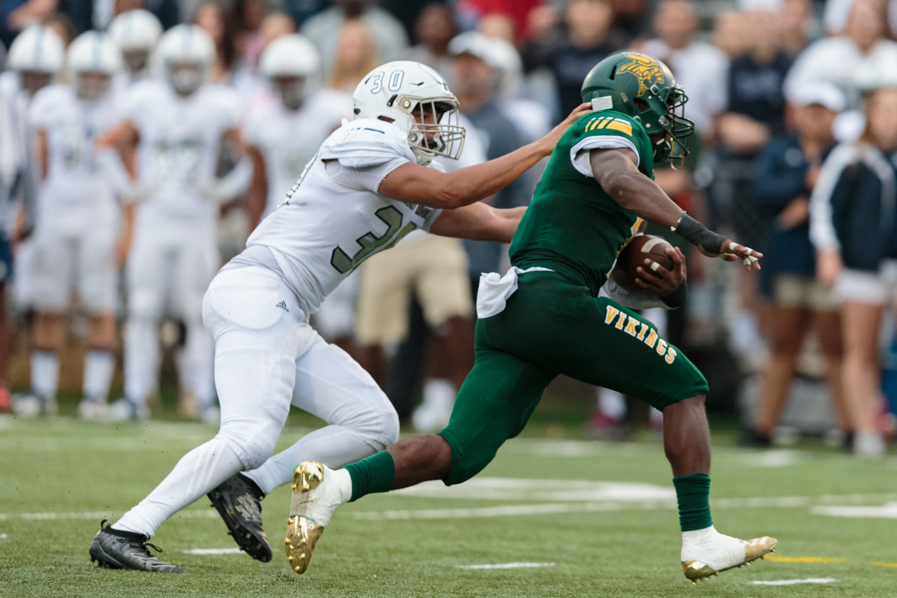 The Ragin' Bulls come from behind in the Battle of the Horns to defeat the Vikings 27-20.